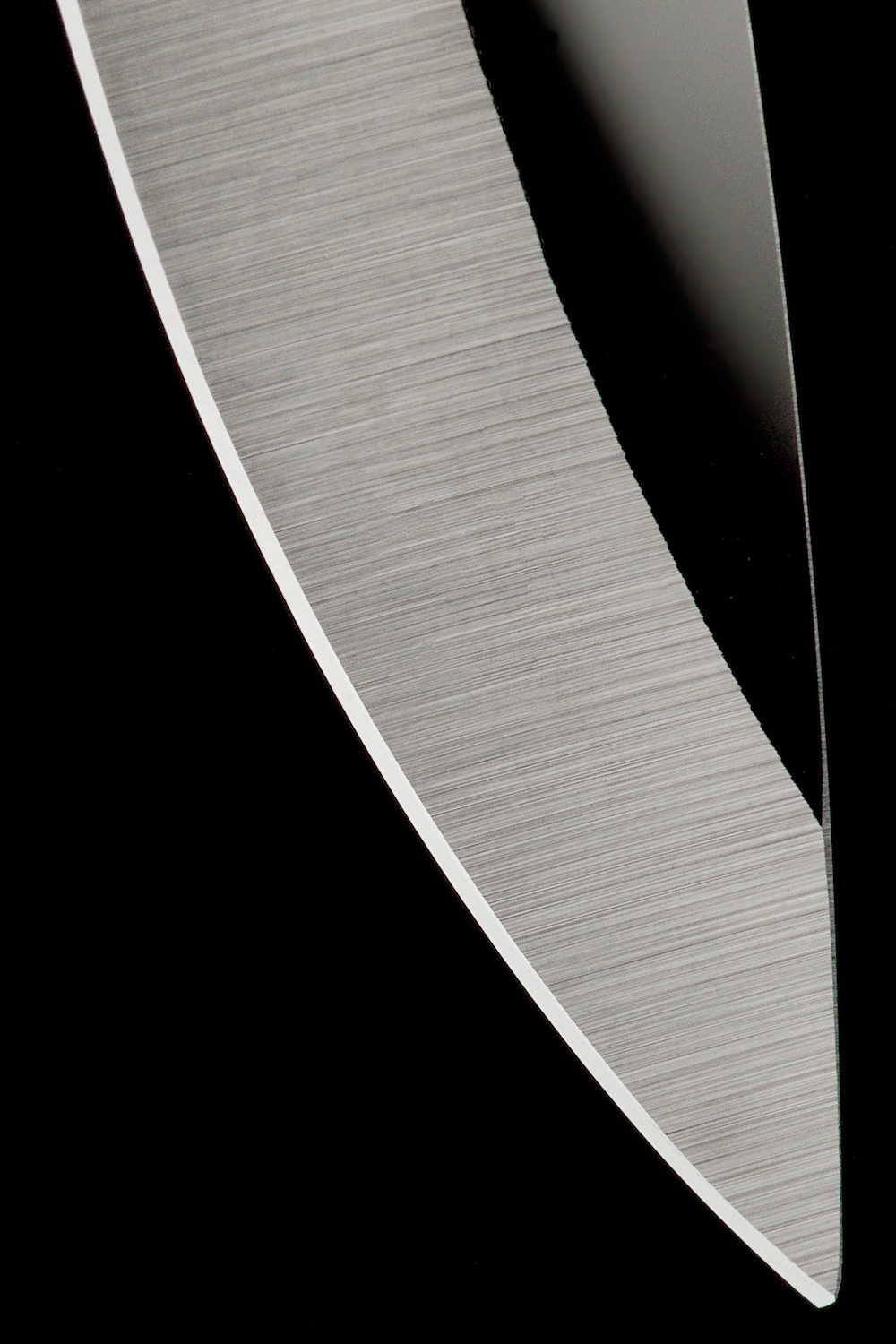 Knife blade detail abstract black & white by Bret Doss Commercial Product Photography Seattle